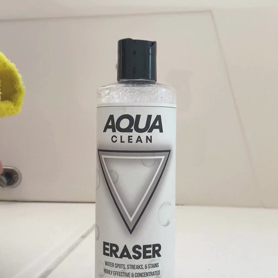 Video showcasing AquaClean Eraser stain removal product bottle on white surface