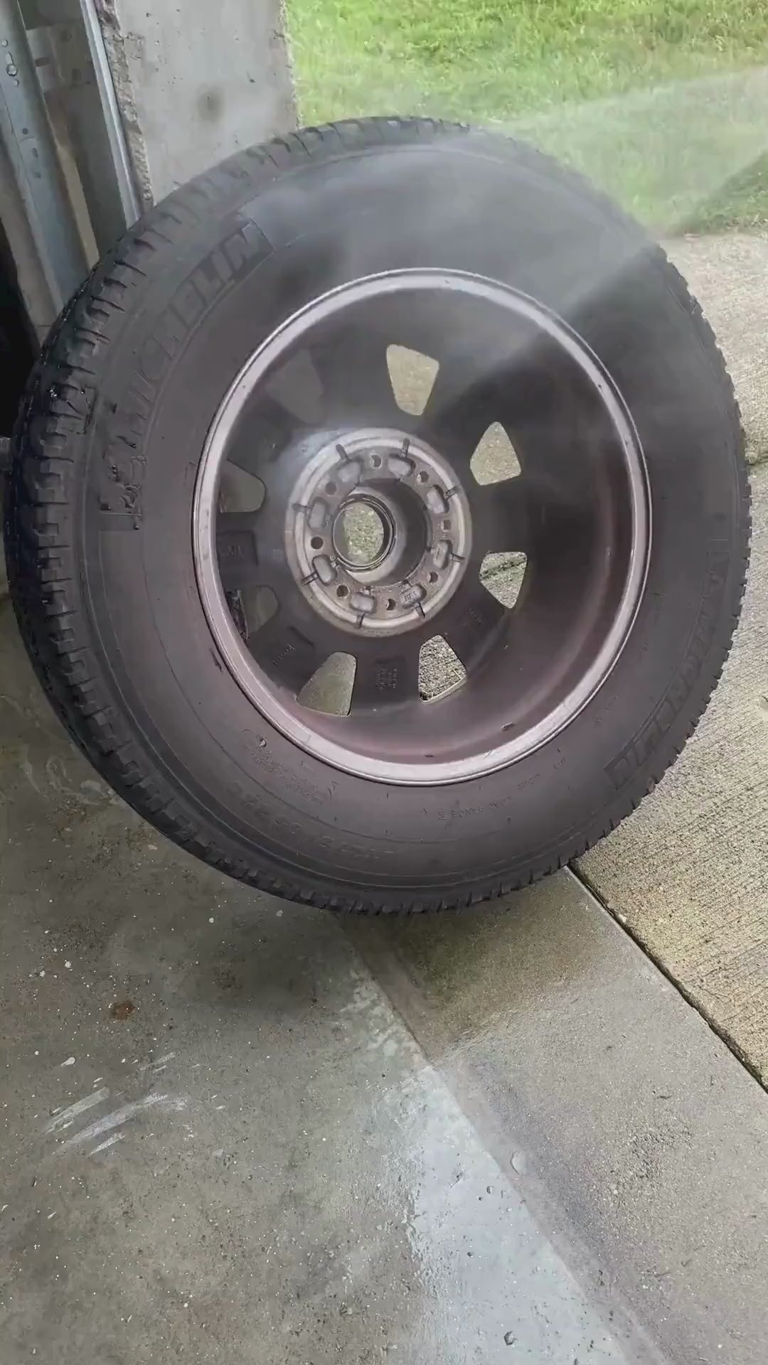 Video showing dirty vehicle tire with grimy wheel rim before cleaning