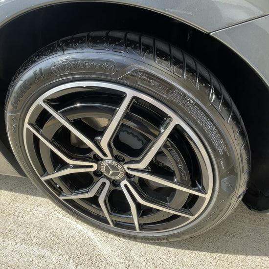 Video of Mercedes-Benz alloy wheel with clean tire on white vehicle